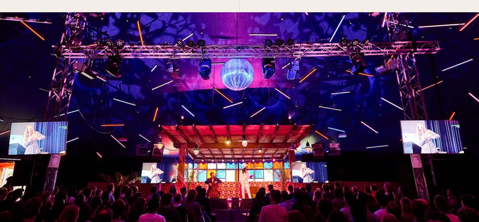 Quantum Delta NL conference stage with a large audience